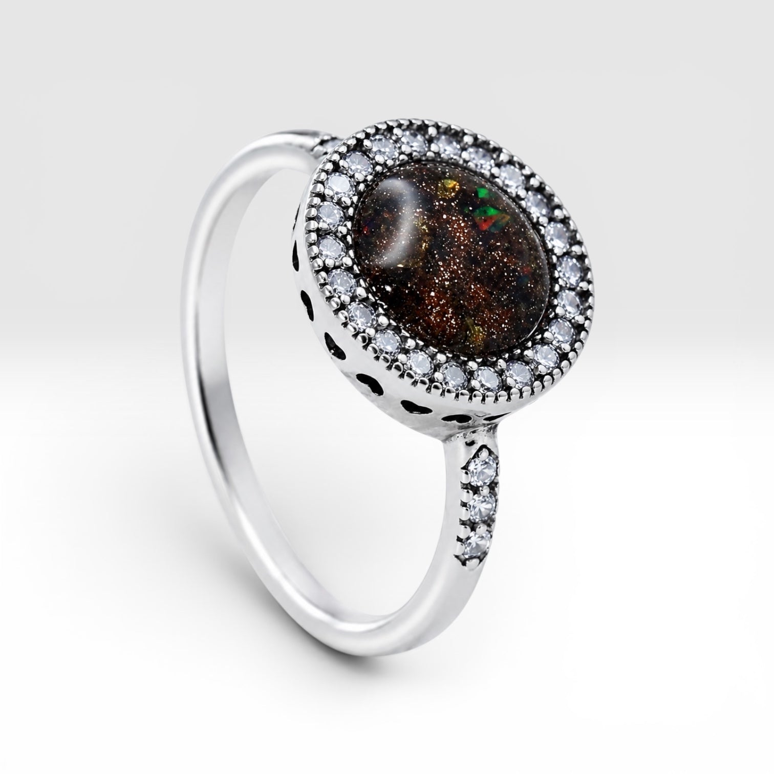 Resin gemstone ring with goldstone sparkle and lava opal shimmer set in sterling silver halo band