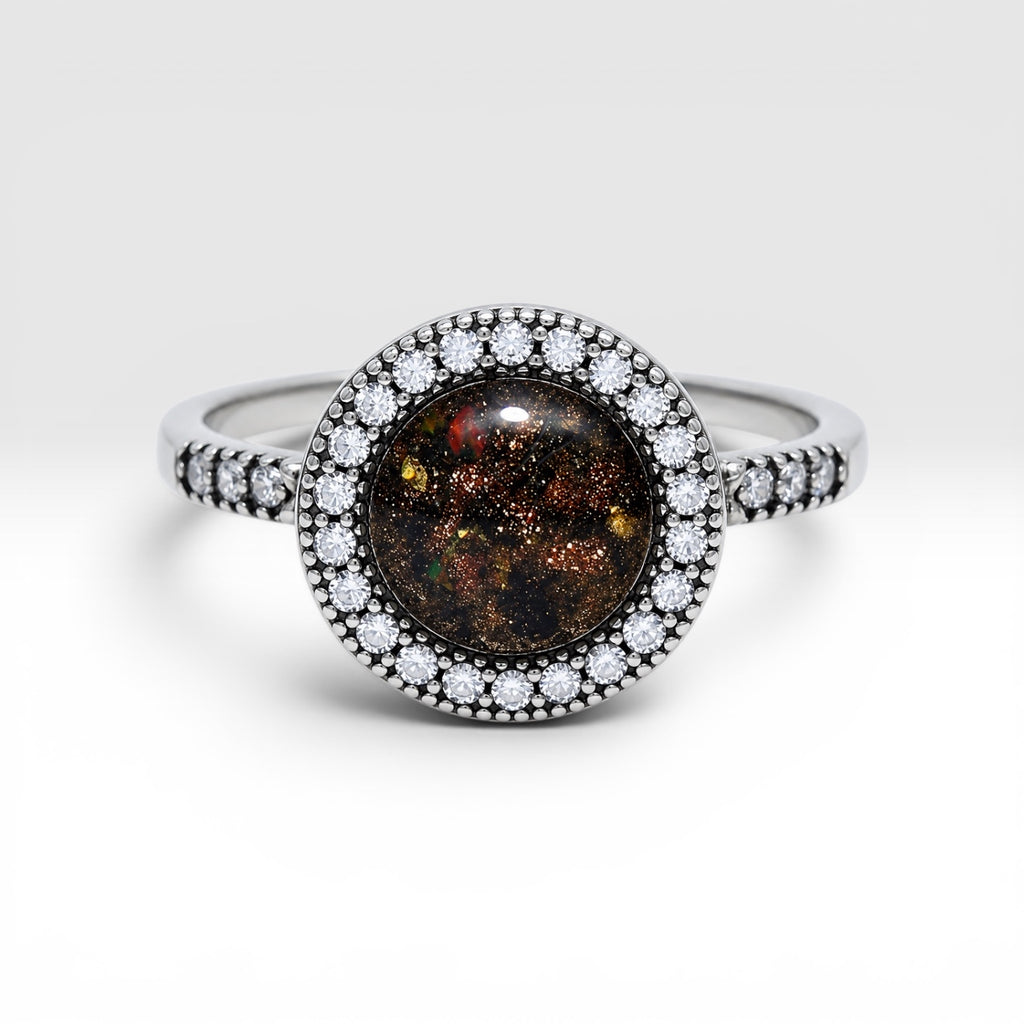Resin gemstone ring with goldstone sparkle and lava opal shimmer set in sterling silver halo band