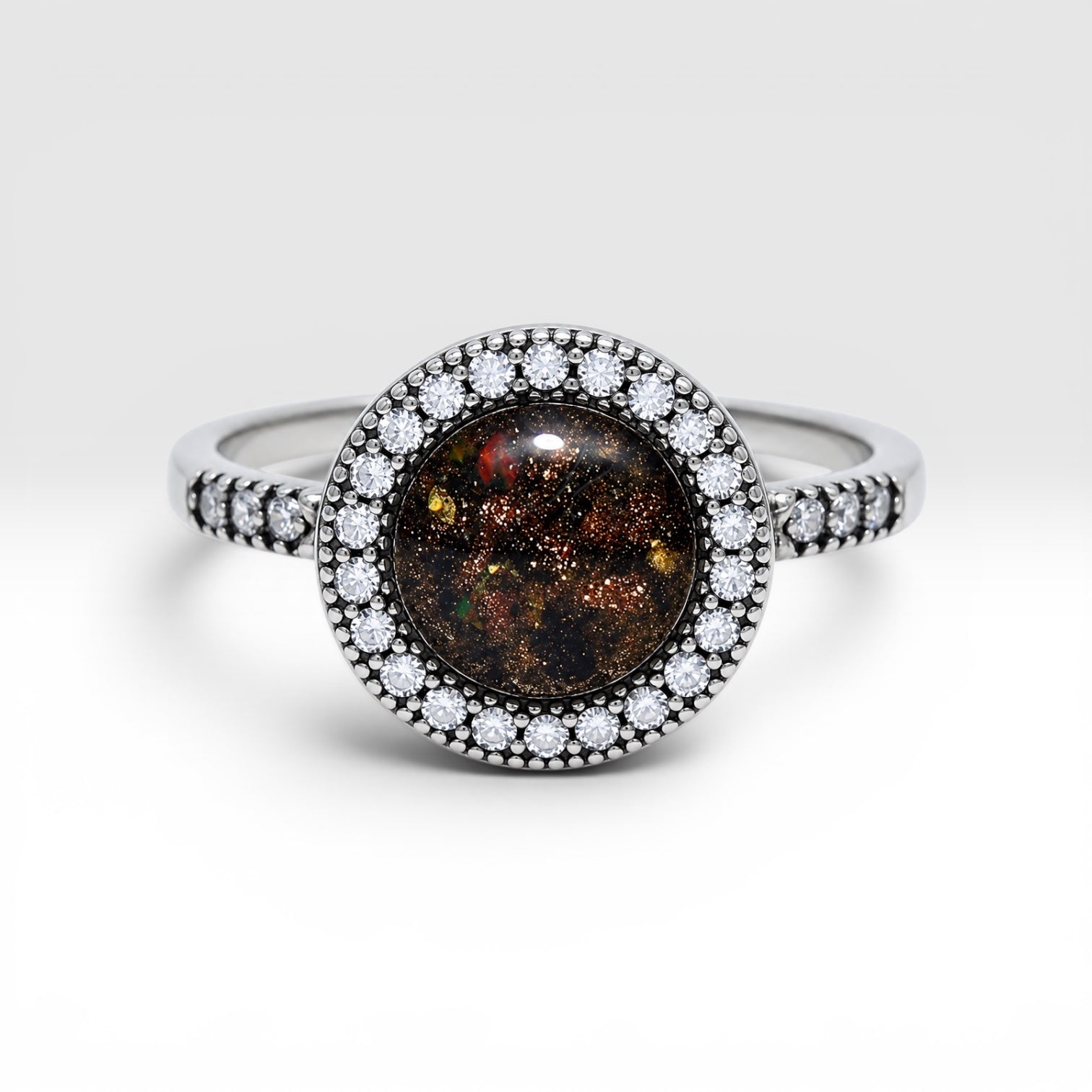 Resin gemstone ring with goldstone sparkle and lava opal shimmer set in sterling silver halo band