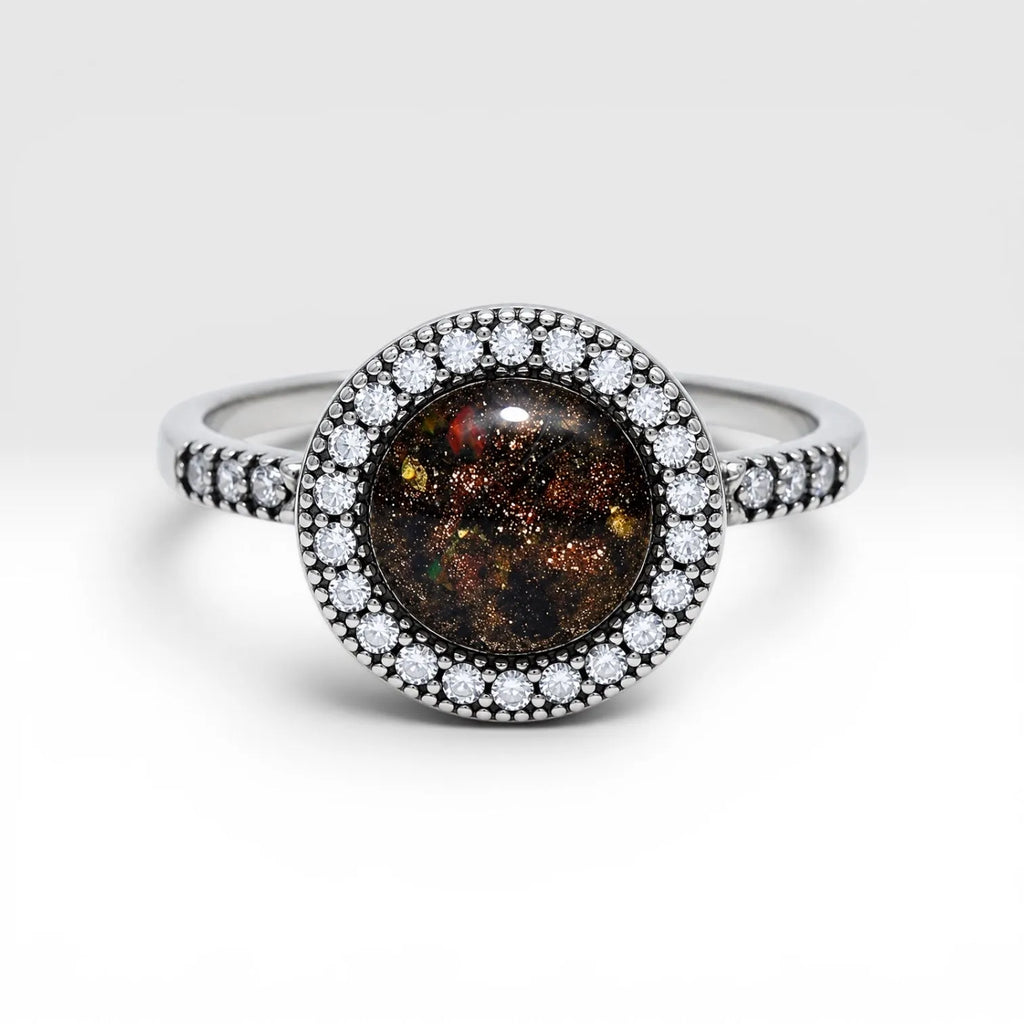 Resin gemstone ring with goldstone sparkle and lava opal shimmer set in sterling silver halo band