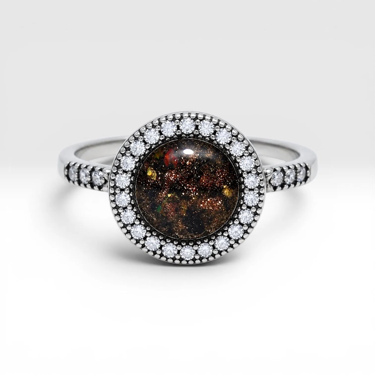Resin gemstone ring with goldstone sparkle and lava opal shimmer set in sterling silver halo band