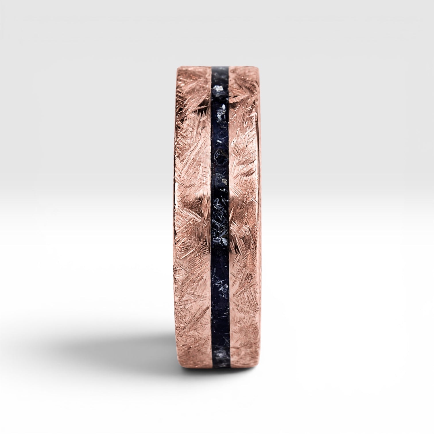 Emberfall rose gold ring featuring meteorite shavings, volcanic stone inlay, and a distressed forged finish handcrafted by Venus Rings.