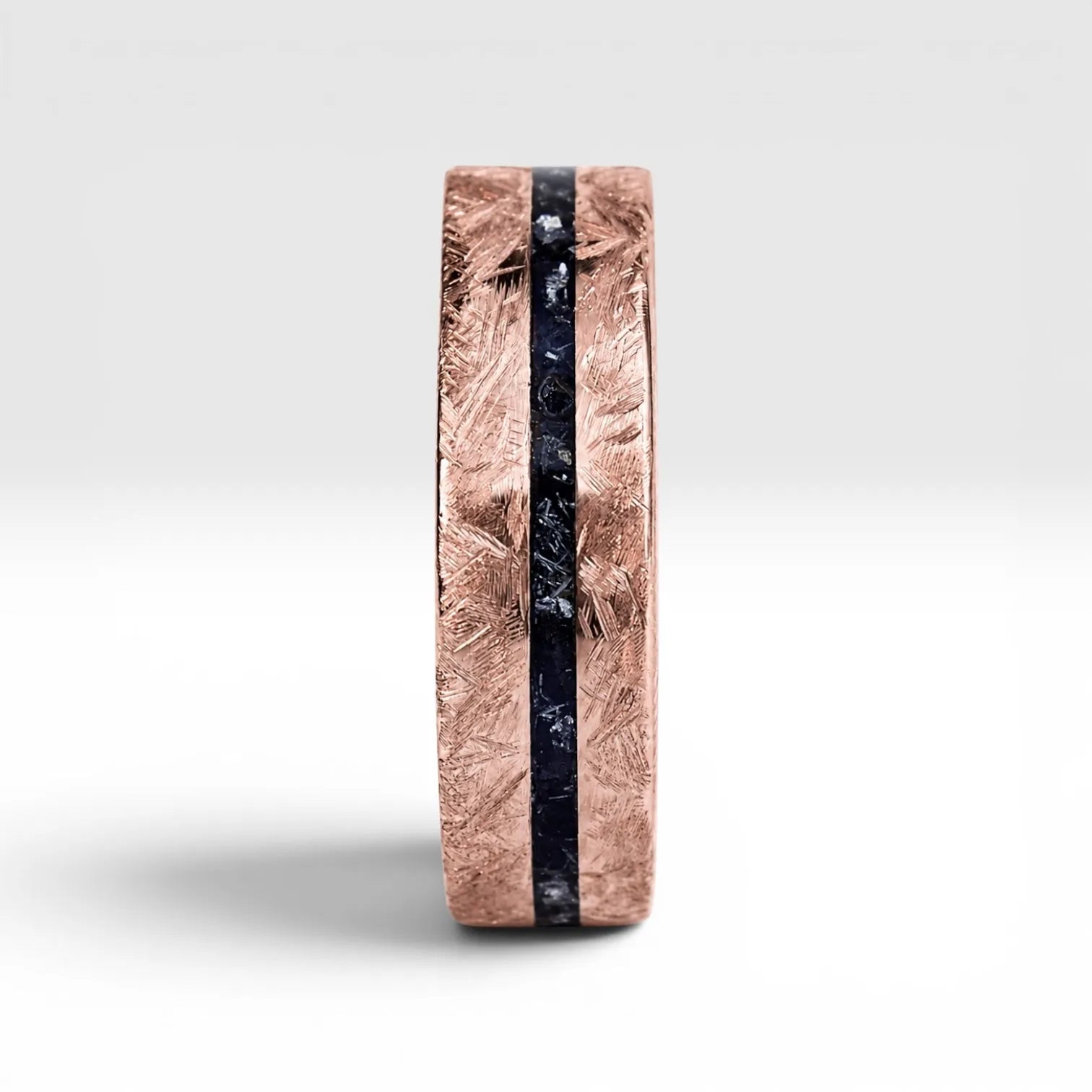 Emberfall rose gold ring featuring meteorite shavings, volcanic stone inlay, and a distressed forged finish handcrafted by Venus Rings.
