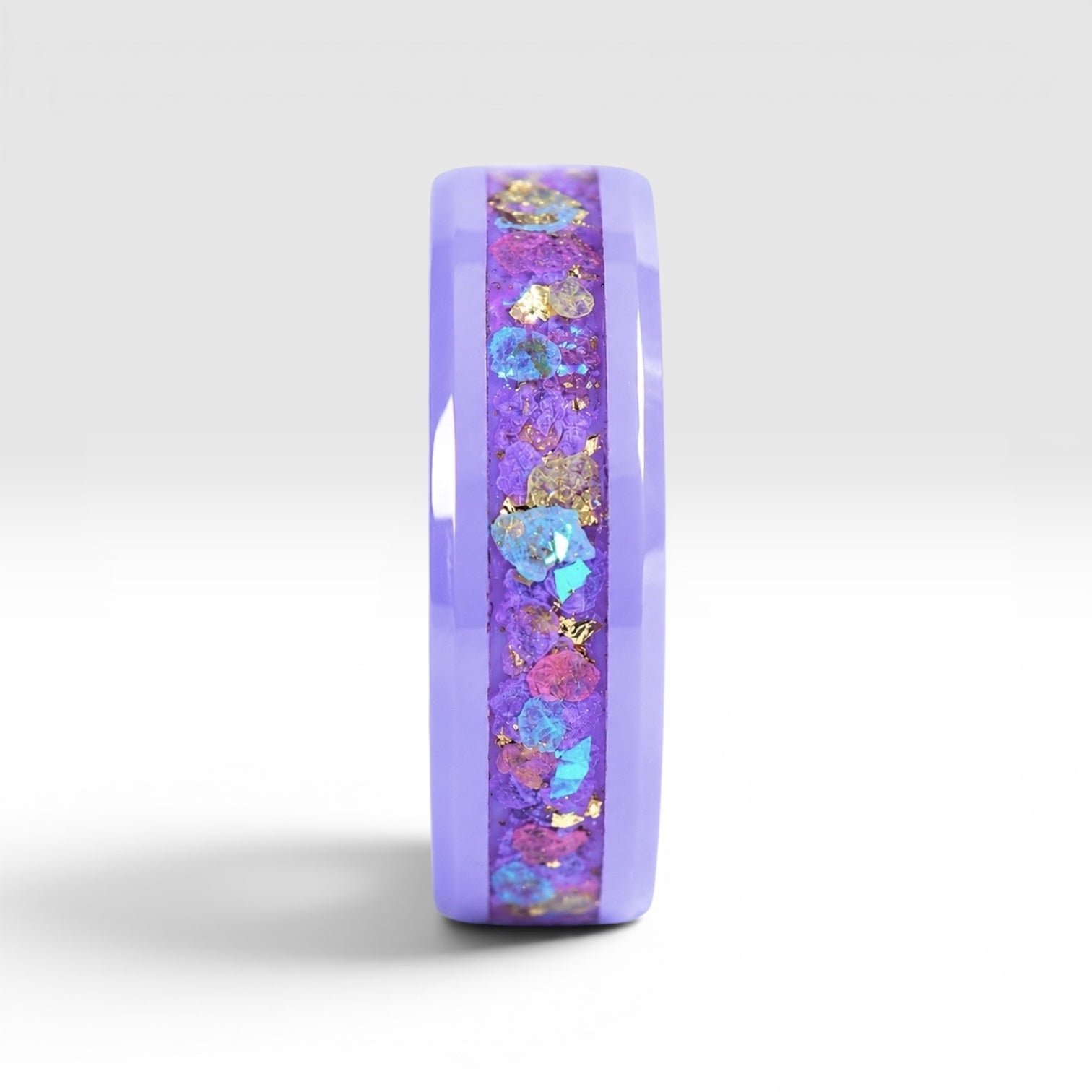 Fairybloom purple ceramic ring featuring real pressed flower petals, iridescent accents, and gold flakes preserved in a handcrafted floral inlay.