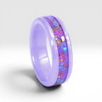 Fairybloom purple ceramic ring featuring real pressed flower petals, iridescent accents, and gold flakes preserved in a handcrafted floral inlay.
