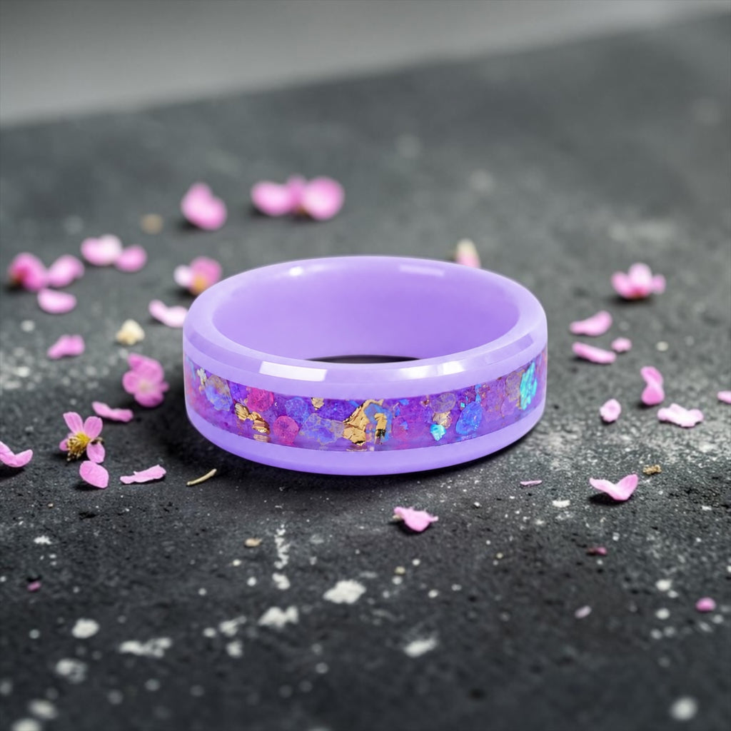 Fairybloom purple ceramic ring featuring real pressed flower petals, iridescent accents, and gold flakes preserved in a handcrafted floral inlay.