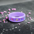 Fairybloom purple ceramic ring featuring real pressed flower petals, iridescent accents, and gold flakes preserved in a handcrafted floral inlay.