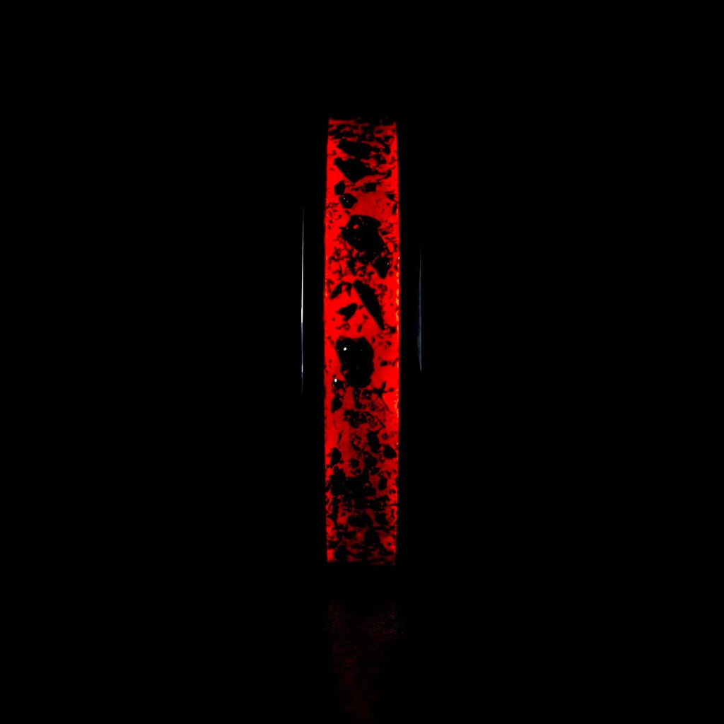 Tungsten ring with meteorite, lava opal and shungite inlay, faceted band with red glow in the dark effect