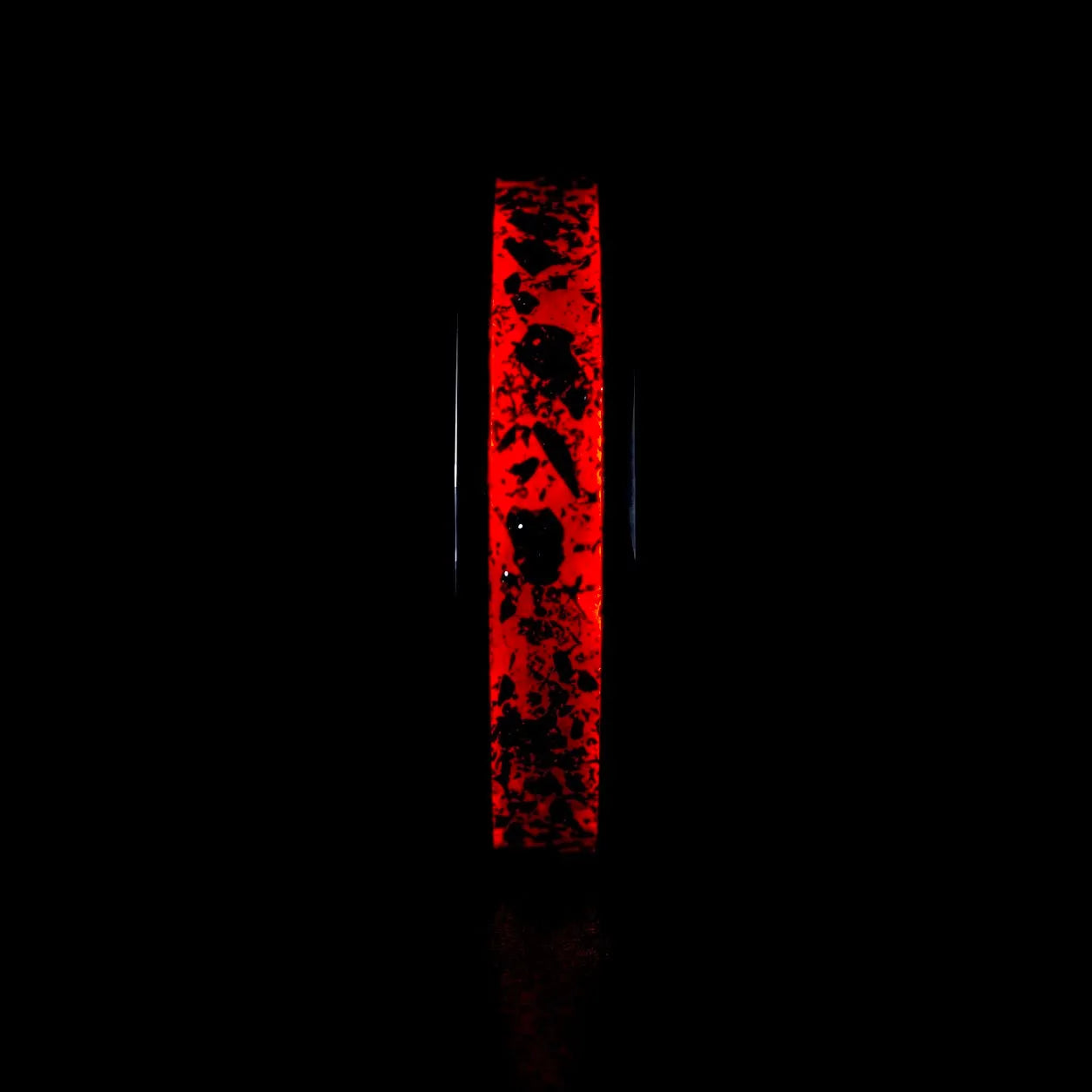 Tungsten ring with meteorite, lava opal and shungite inlay, faceted band with red glow in the dark effect