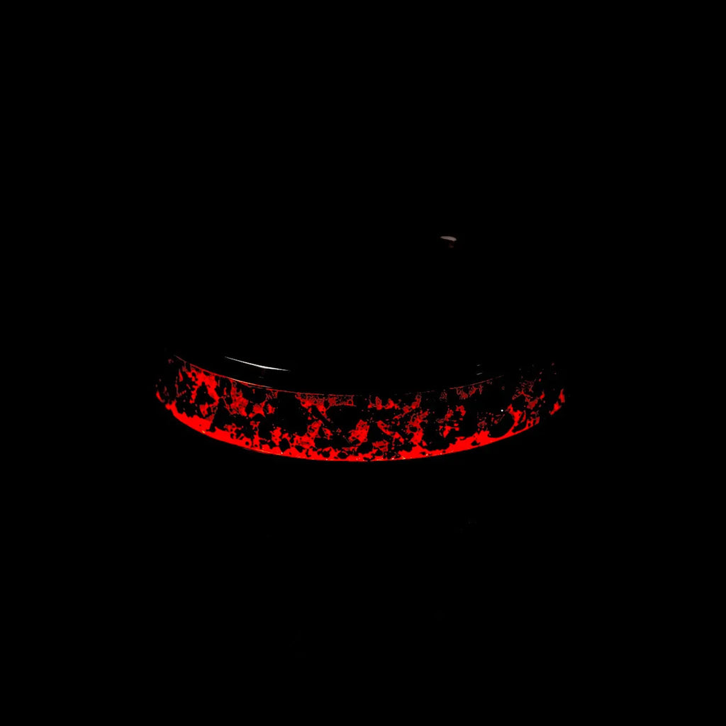 Tungsten ring with meteorite, lava opal and shungite inlay, faceted band with red glow in the dark effect