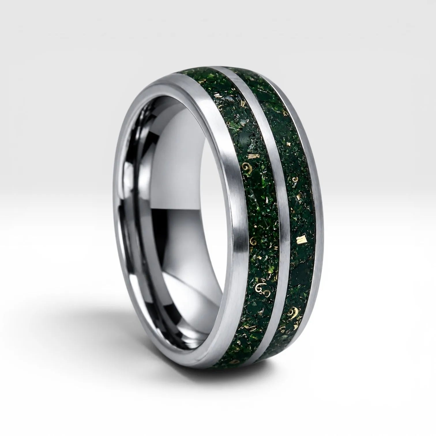 Close-up of tungsten ring with green goldstone and gold shavings showing deep green shimmer and metallic texture