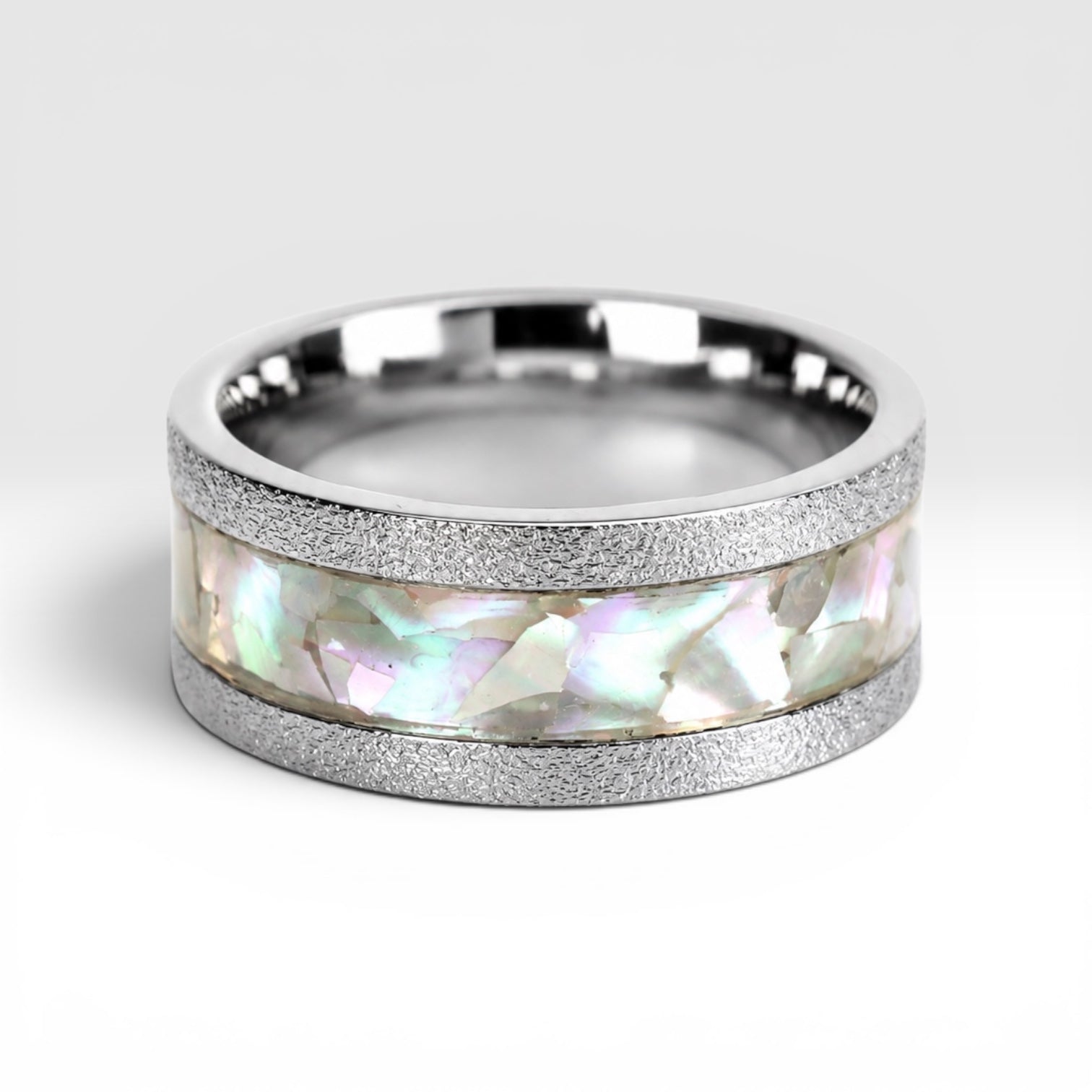 Angled view of Moonveil cobalt ring showcasing luminous mother of pearl inlay and frosted textured finish.