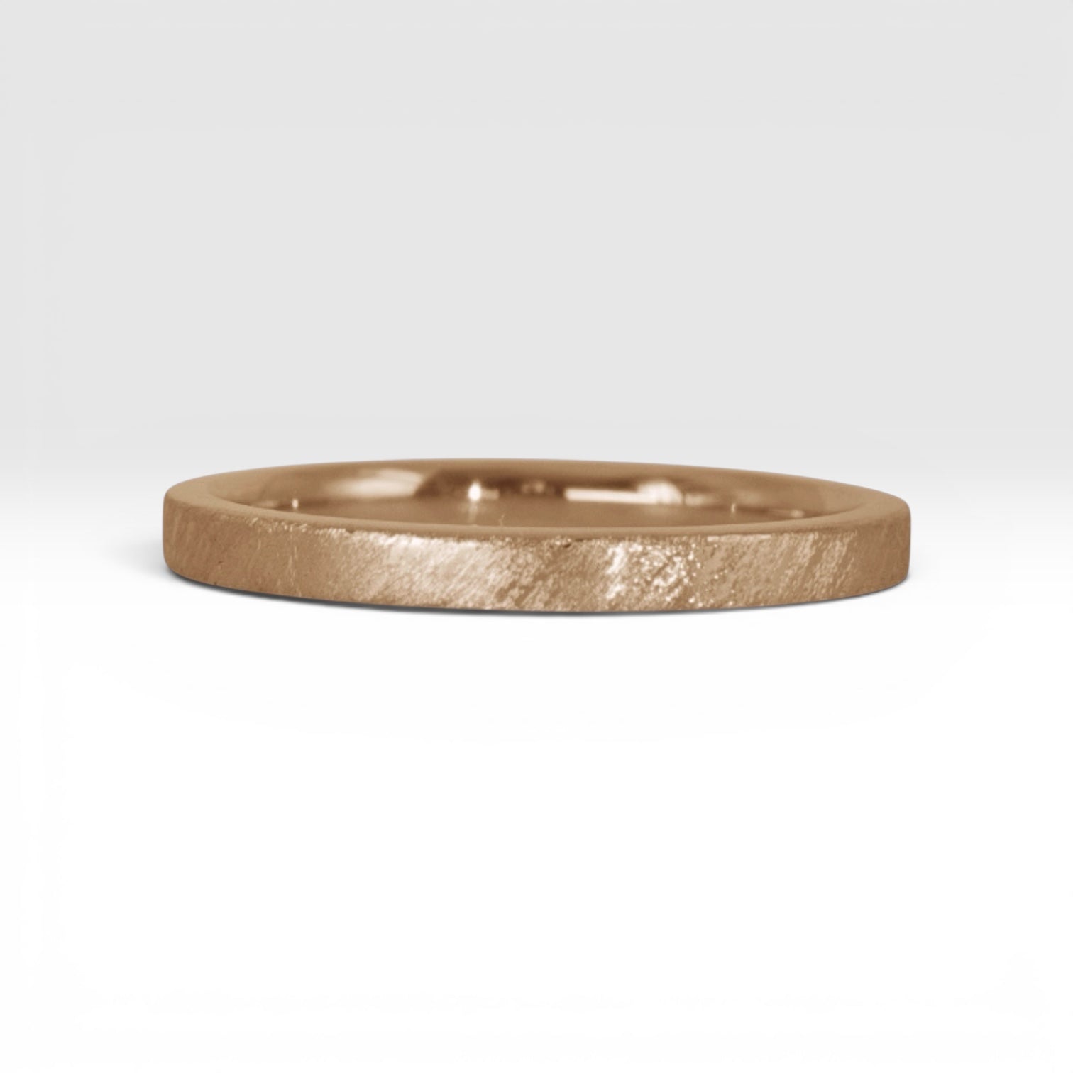Órbita Corte 2mm rose gold stackable ring with hand-applied diagonal texture finish, minimalist women's stacking band