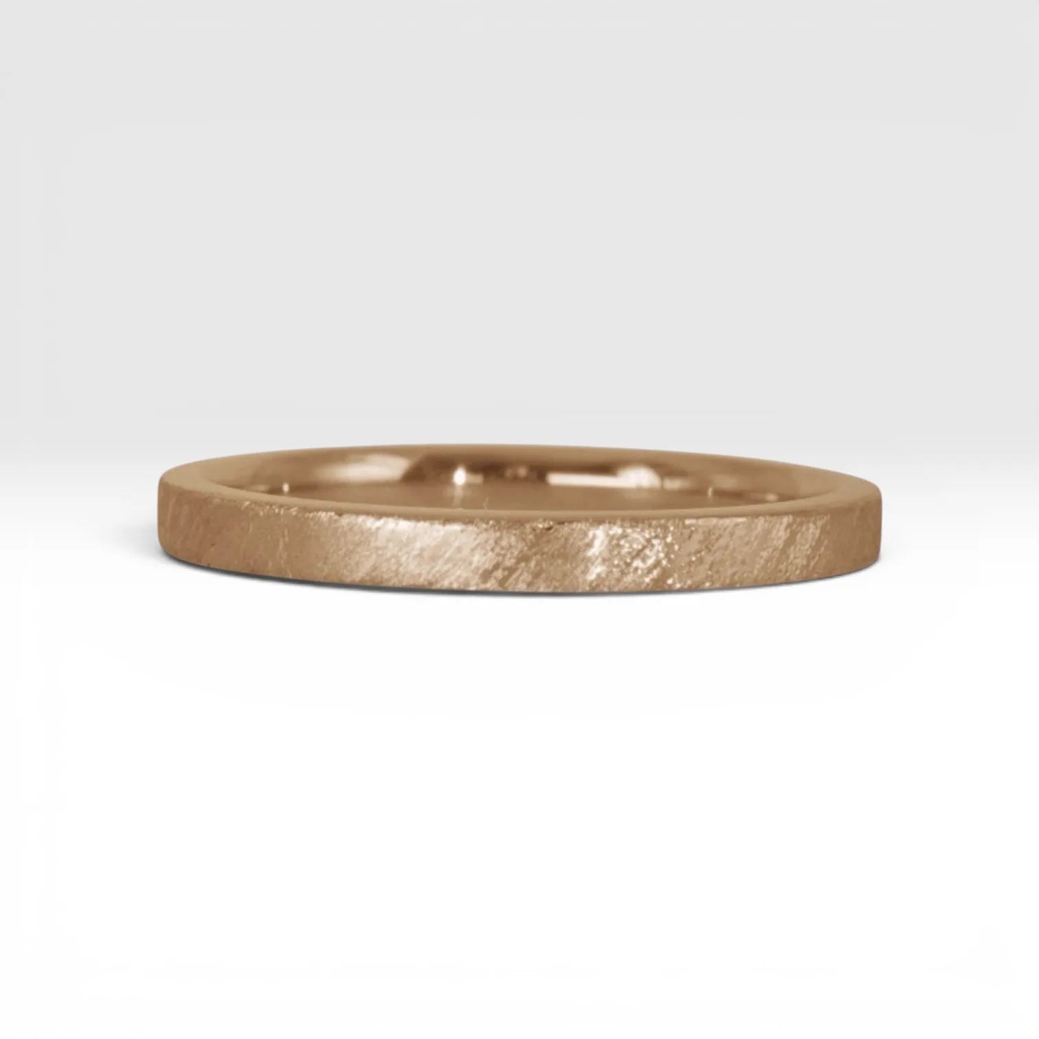 Órbita Corte 2mm rose gold stackable ring with hand-applied diagonal texture finish, minimalist women's stacking band