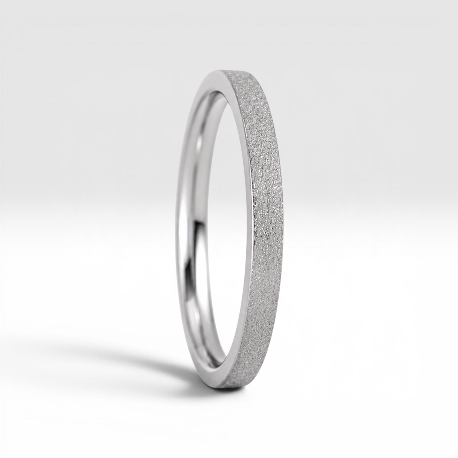 Órbita Luz 2mm stackable ring with frosted finish, luminous surface, handcrafted in Utah