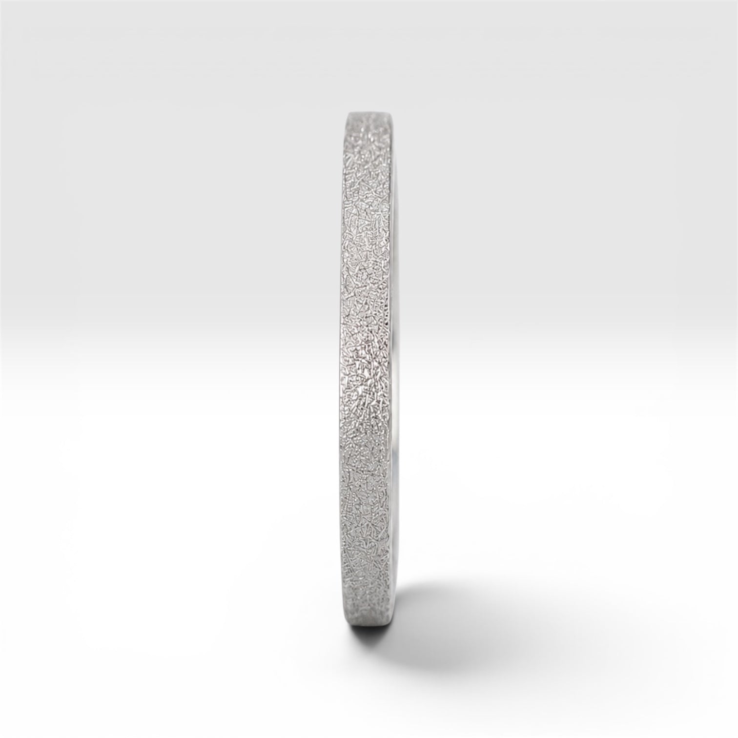 Órbita Luz 2mm stackable ring with frosted finish, luminous surface, handcrafted in Utah