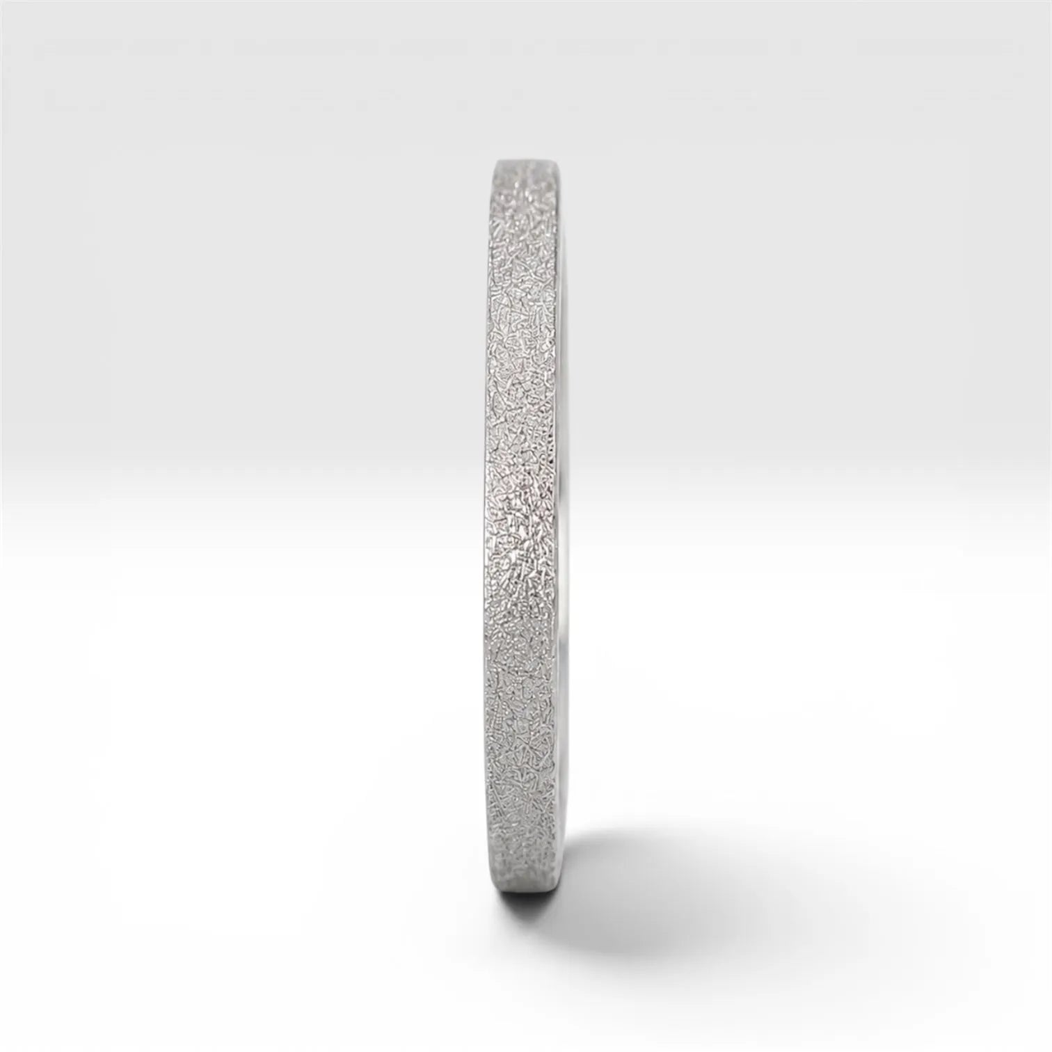 Órbita Luz 2mm stackable ring with frosted finish, luminous surface, handcrafted in Utah