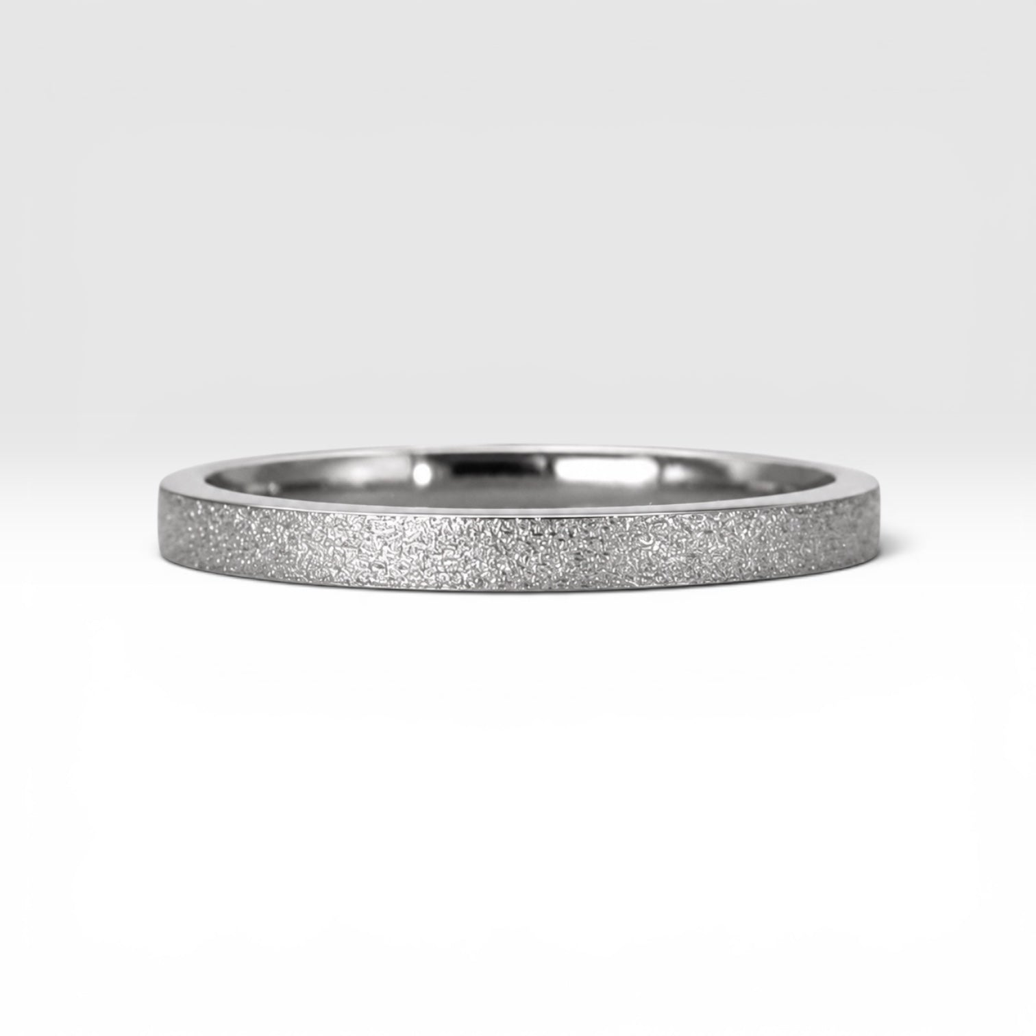 Órbita Luz 2mm stackable ring with frosted finish, luminous surface, handcrafted in Utah