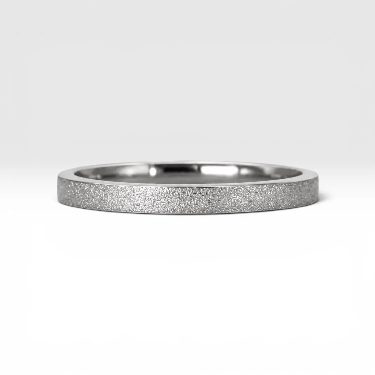 Órbita Luz 2mm stackable ring with frosted finish, luminous surface, handcrafted in Utah