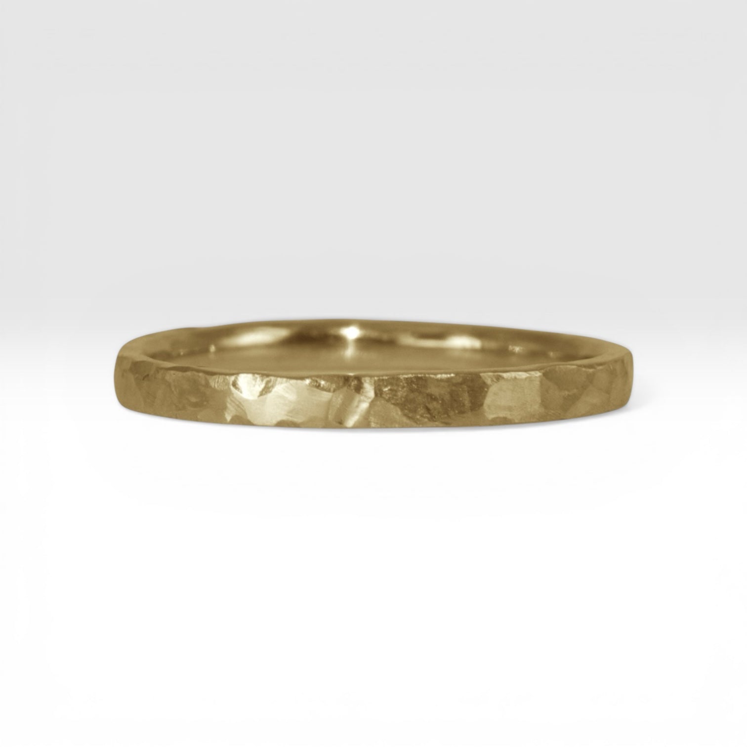Órbita Roca 2mm hammered gold stackable ring, flat profile with hand-textured surface, polished interior, made in Utah