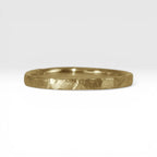 Órbita Roca 2mm hammered gold stackable ring, flat profile with hand-textured surface, polished interior, made in Utah
