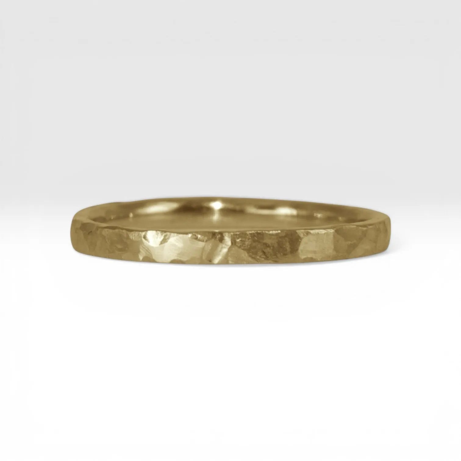 Órbita Roca 2mm hammered gold stackable ring, flat profile with hand-textured surface, polished interior, made in Utah