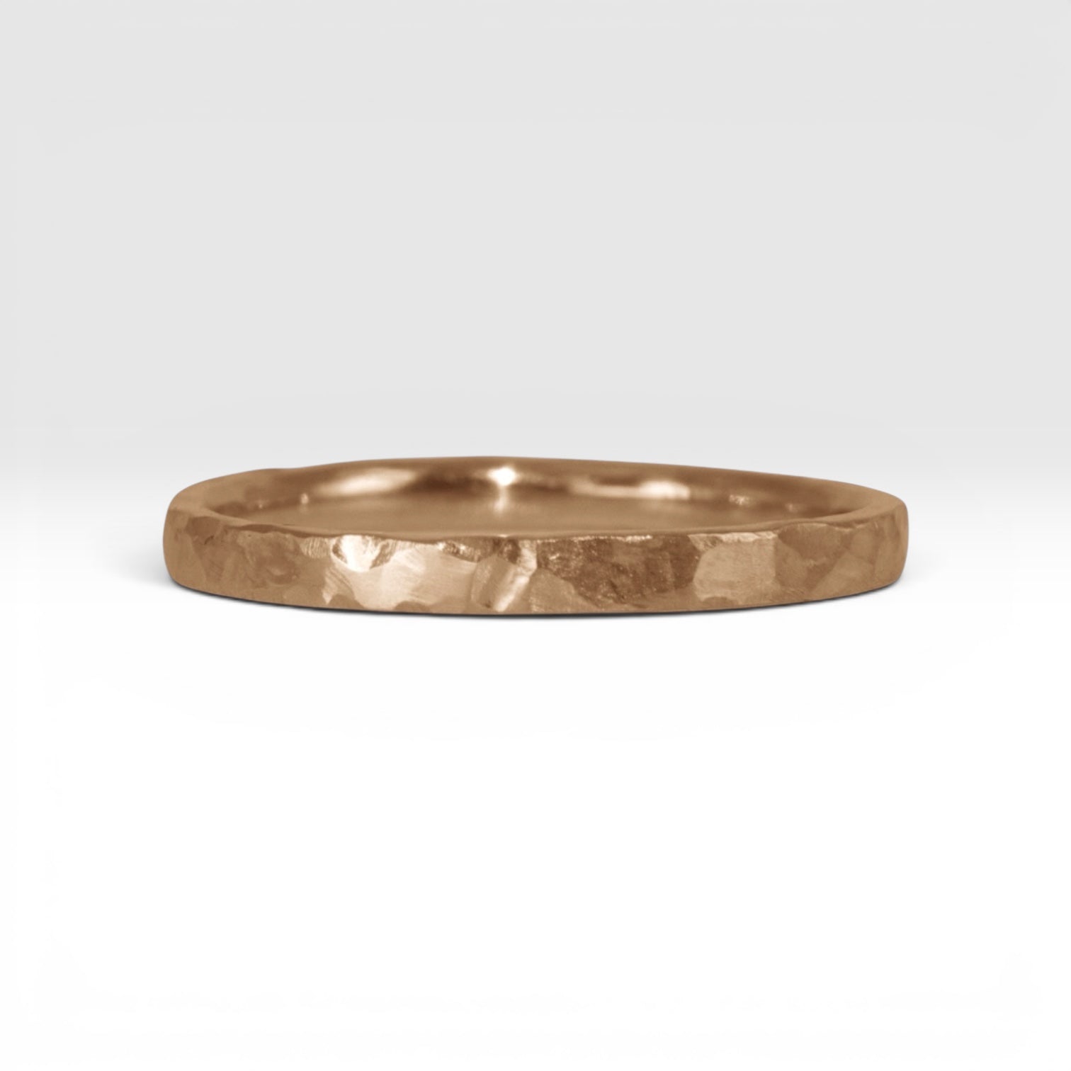 Órbita Roca 2mm hammered rose gold stackable ring, flat profile with hand-textured surface, polished interior, made in Utah