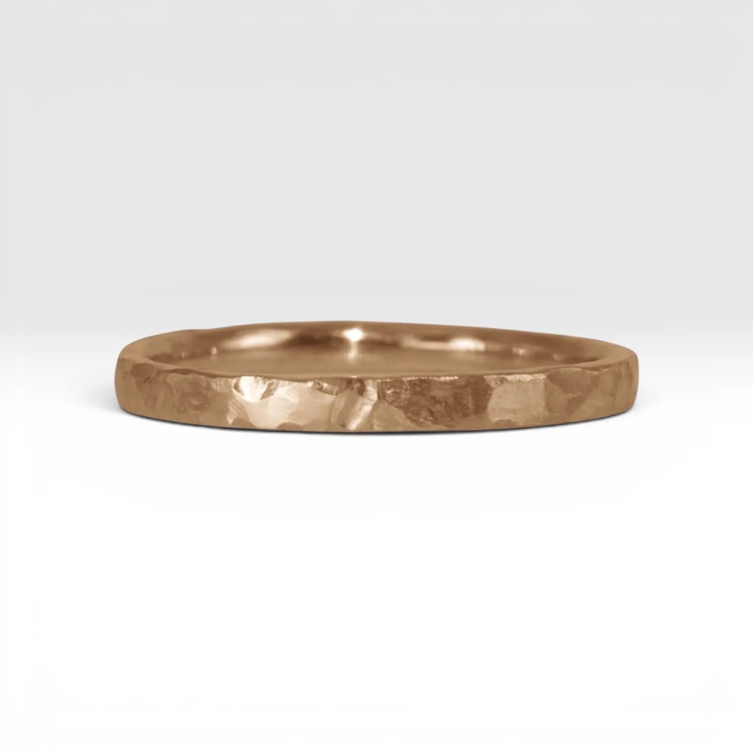 Órbita Roca 2mm hammered rose gold stackable ring, flat profile with hand-textured surface, polished interior, made in Utah