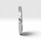 Órbita Roca hammered stacking ring showing raw textured surface and slim 2mm profile