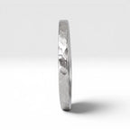 Órbita Roca hammered stacking ring showing raw textured surface and slim 2mm profile