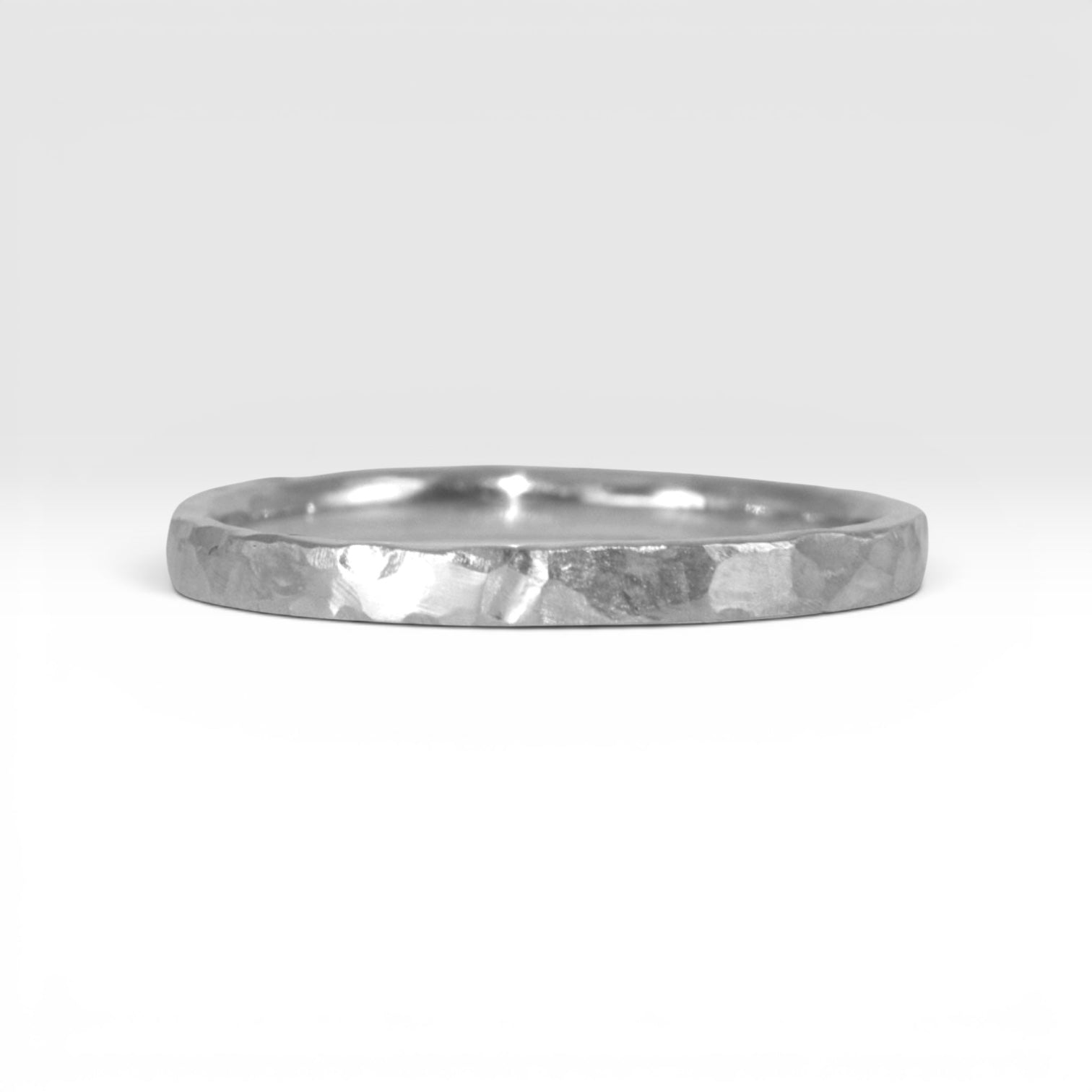 Órbita Roca 2mm hammered sterling silver stackable ring, flat profile with hand-textured surface, polished interior, made in Utah