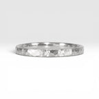 Órbita Roca hammered stacking ring showing raw textured surface and slim 2mm profile
