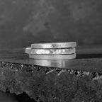 Órbita collection — three 2mm  stackable rings stacked together showing hammered, frosted, and diagonal textures, handcrafted in Utah