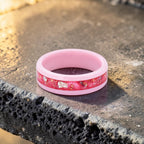 Ceramic ring featuring sea glass fragments and gold leaf with soft pink and teal contrast