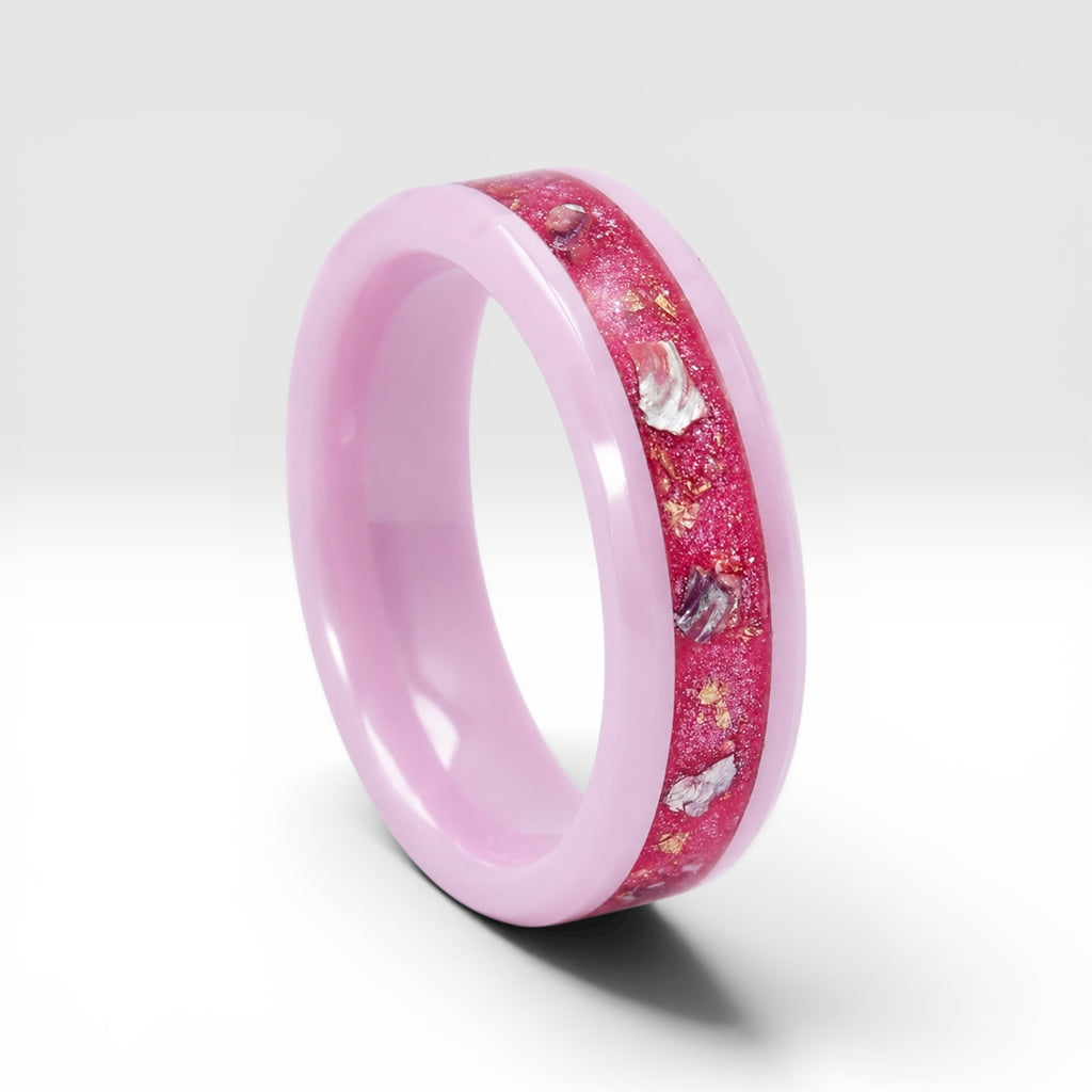 Ceramic ring featuring sea glass fragments and gold leaf with soft pink and teal contrast