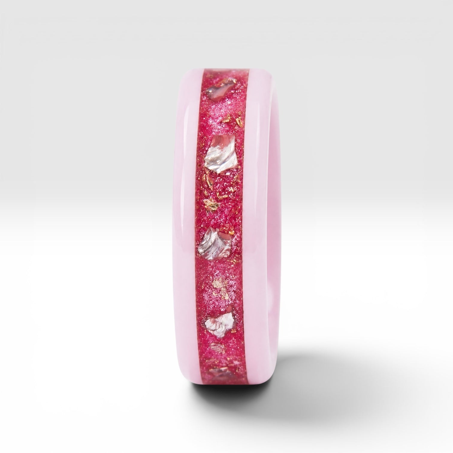 Ceramic ring featuring sea glass fragments and gold leaf with soft pink and teal contrast