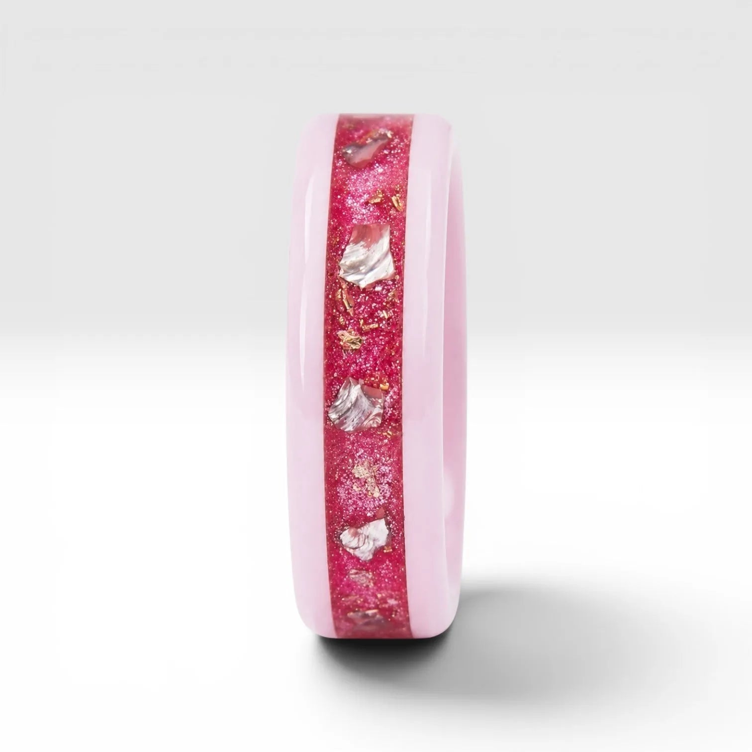 Ceramic ring featuring sea glass fragments and gold leaf with soft pink and teal contrast