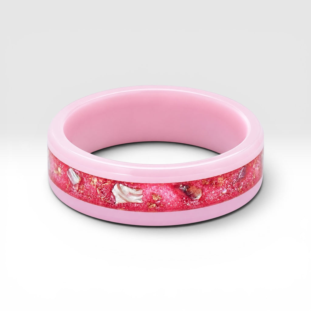 Ceramic ring featuring sea glass fragments and gold leaf with soft pink and teal contrast