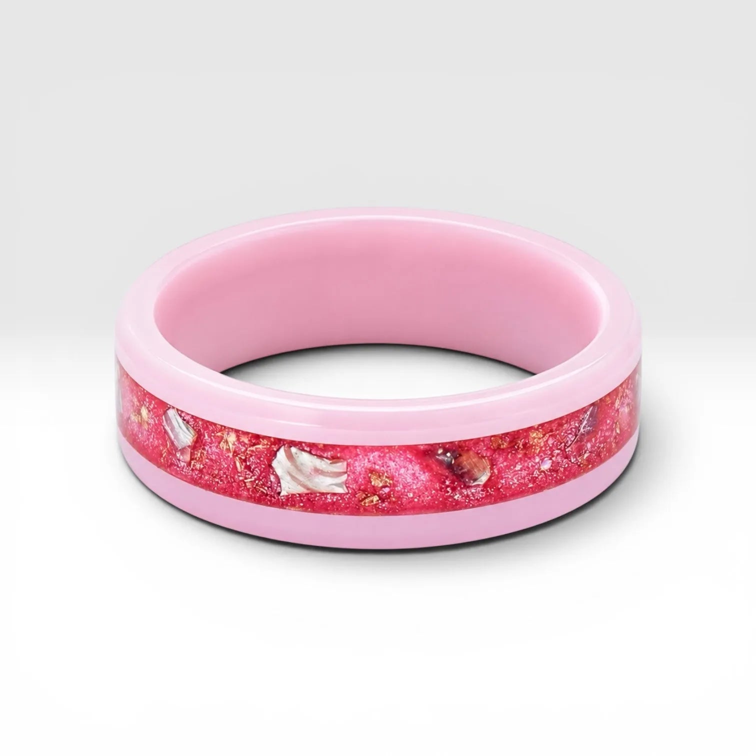 Ceramic ring featuring sea glass fragments and gold leaf with soft pink and teal contrast
