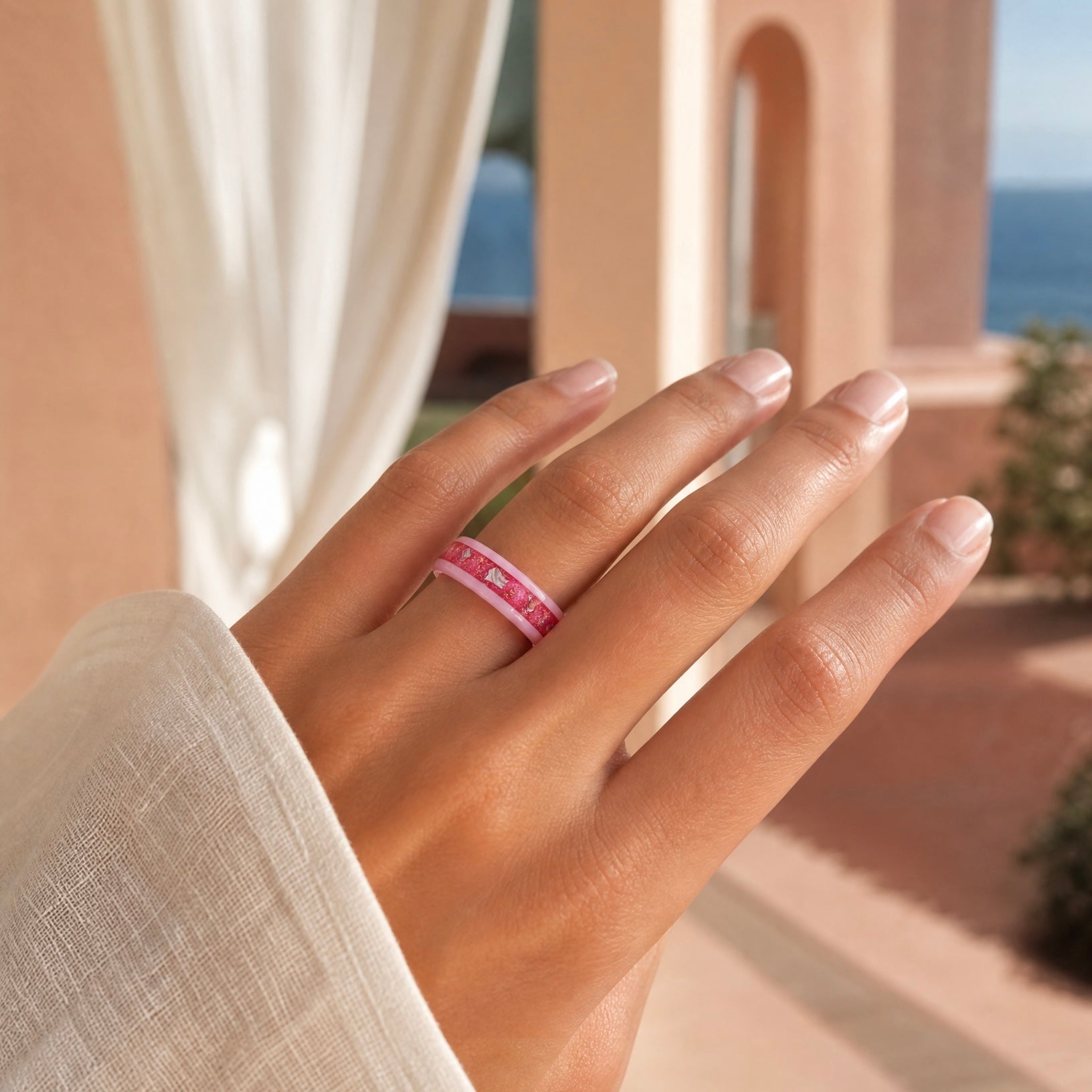Ceramic ring featuring sea glass fragments and gold leaf with soft pink and teal contrast