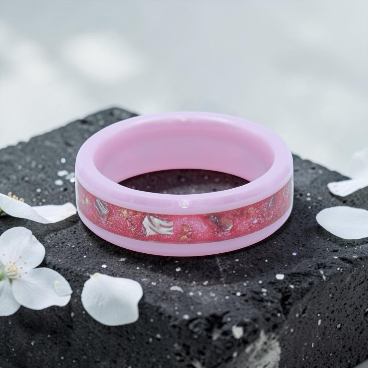 Ceramic ring featuring sea glass fragments and gold leaf with soft pink and teal contrast