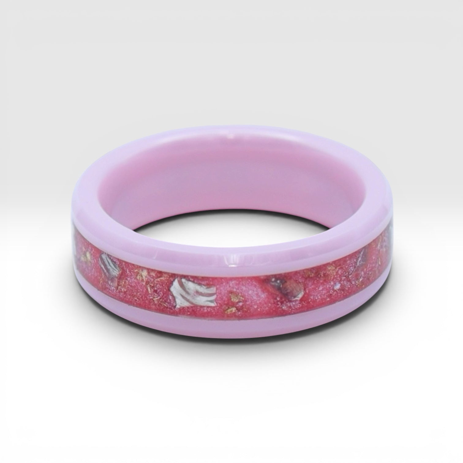 Ceramic ring featuring sea glass fragments and gold leaf with soft pink and teal contrast