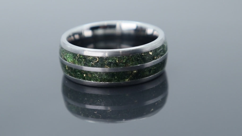 Handcrafted tungsten ring with green goldstone and gold accents, inspired by nature with a refined luxury finish