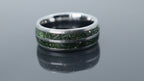 Handcrafted tungsten ring with green goldstone and gold accents, inspired by nature with a refined luxury finish