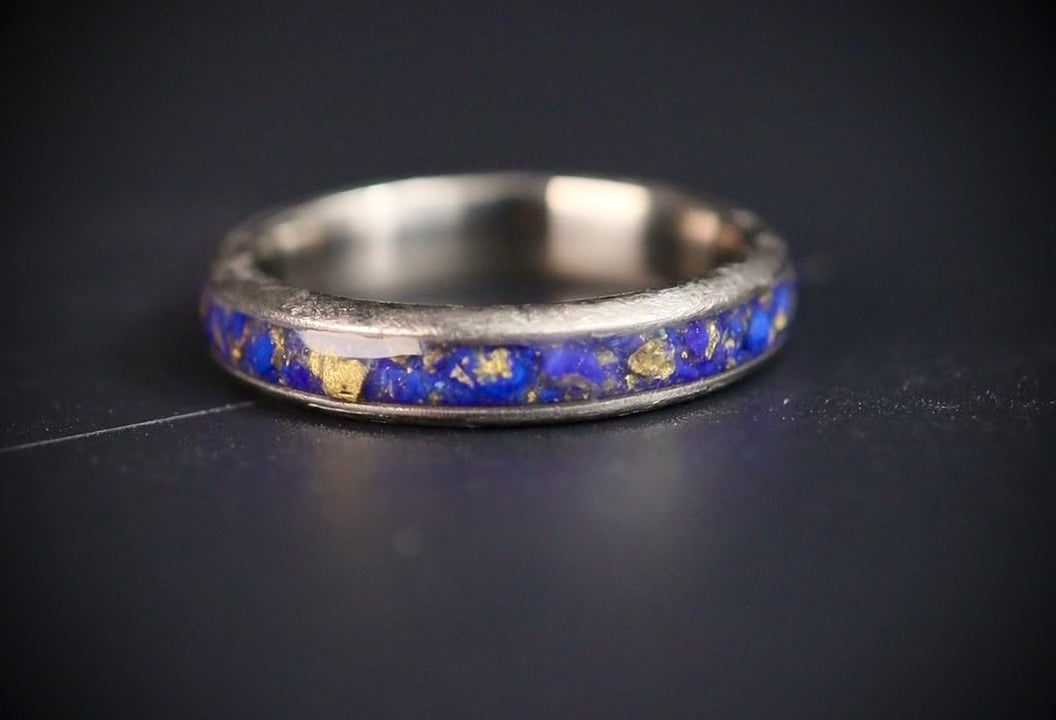 Emberfall rose gold ring featuring meteorite shavings, volcanic stone inlay, and a distressed forged finish handcrafted by Venus Rings.