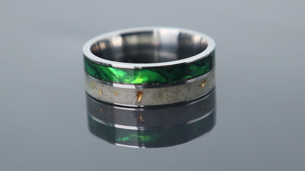 Titanium ring with iridescent paua shell inlay