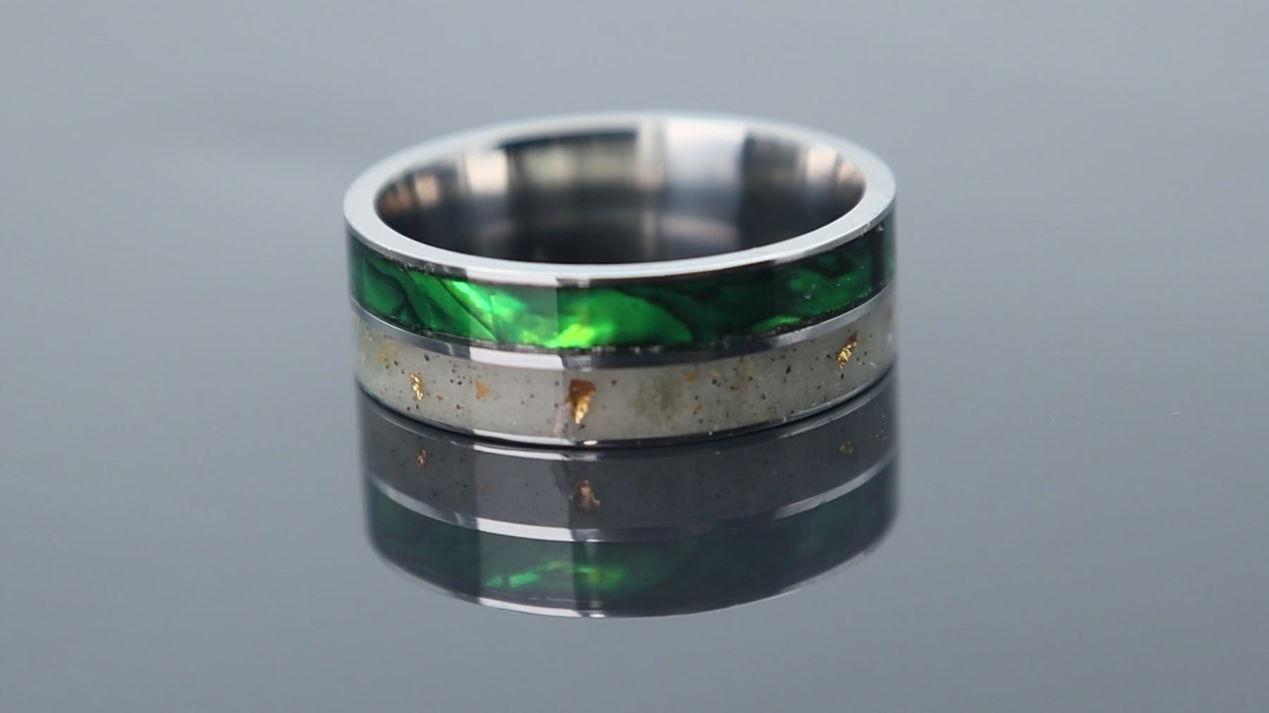Titanium ring with iridescent paua shell inlay