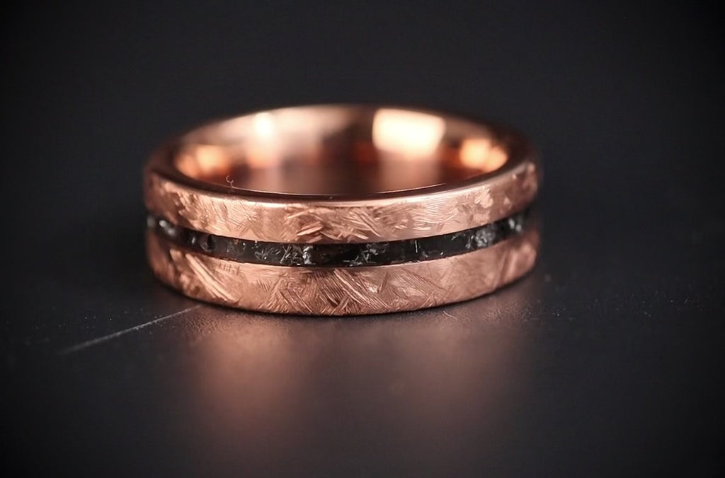 Emberfall rose gold ring featuring meteorite shavings, volcanic stone inlay, and a distressed forged finish handcrafted by Venus Rings.