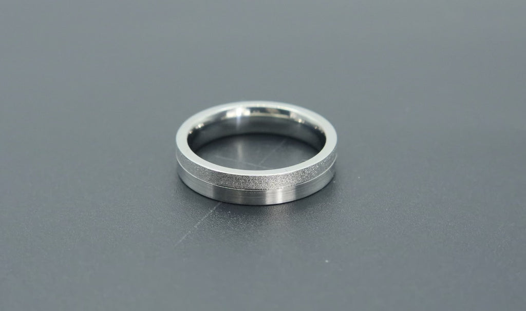 4mm women's wedding band featuring two-tone frosted finish and satin finish with architectural groove detail