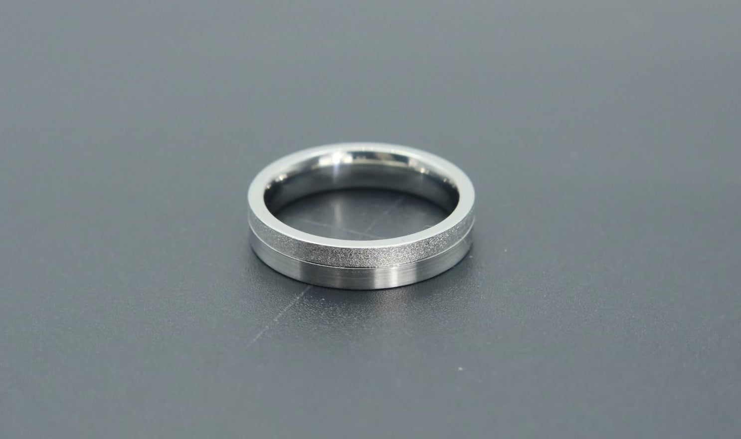 4mm women's wedding band featuring two-tone frosted finish and satin finish with architectural groove detail
